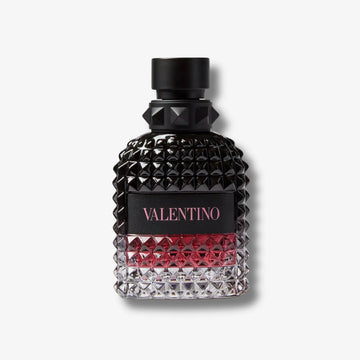 Valentino Uomo Born in roma intense black & red perfume bottle front on a grey background