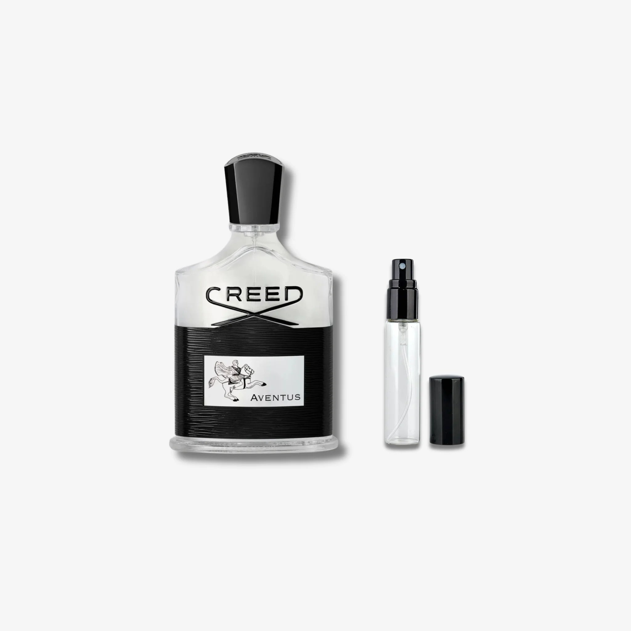 Creed Aventus perfume bottle with a smaller sample bottle on a white background