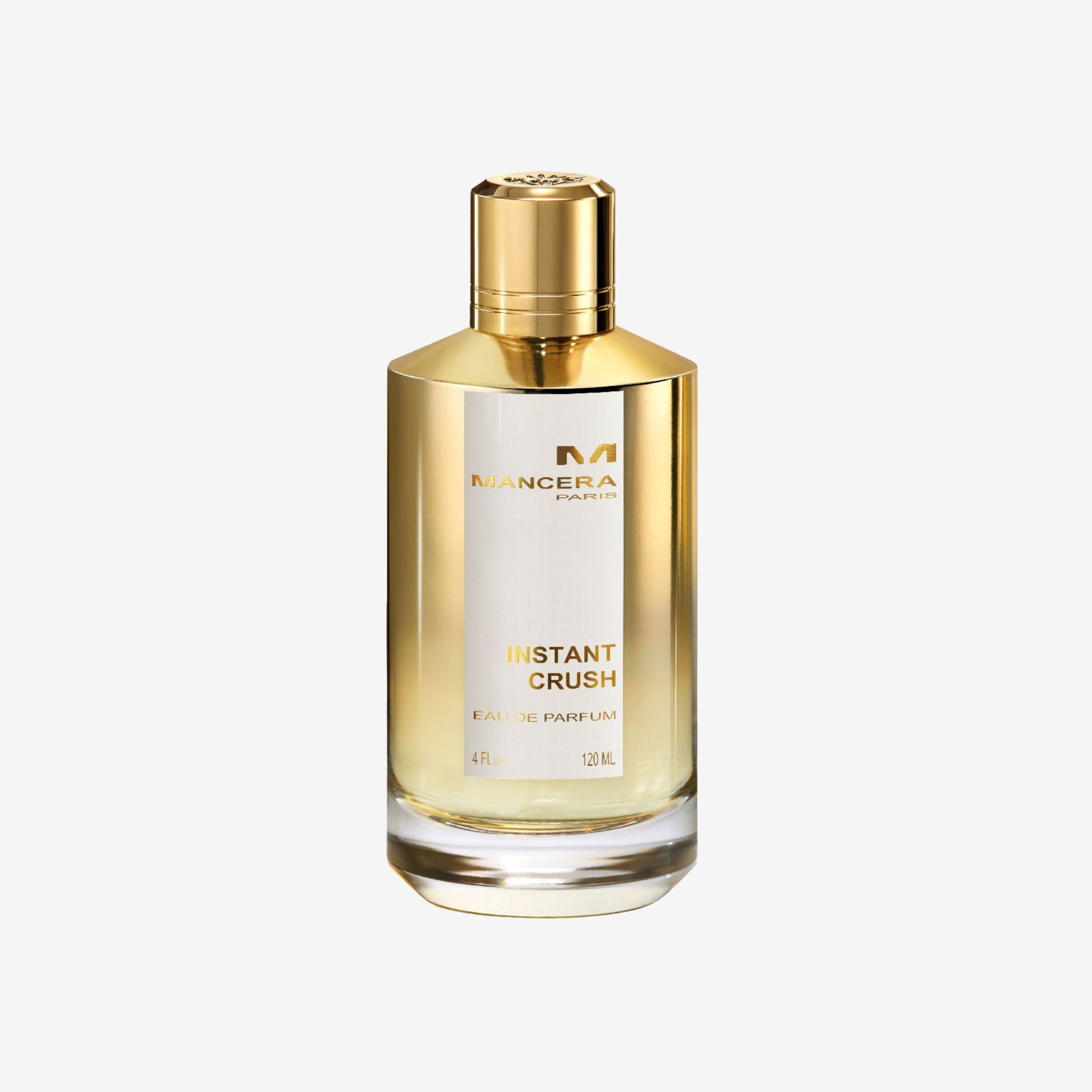 Close-up of Mancera Instant Crush EDP bottle showcasing sleek transparent design with pink liquid and premium luxury branding.