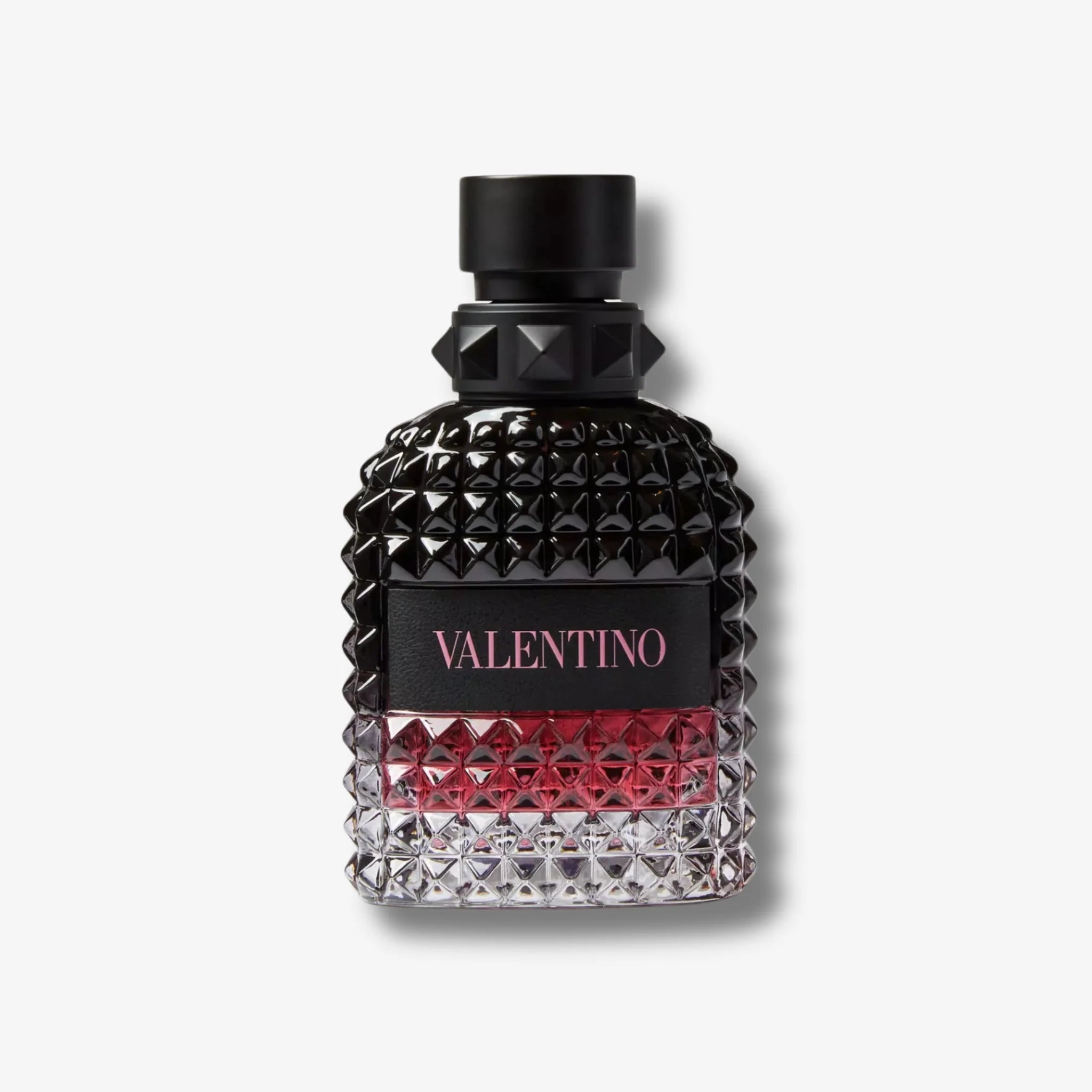 Valentino Uomo Born in roma intense black & red perfume bottle front on a grey background