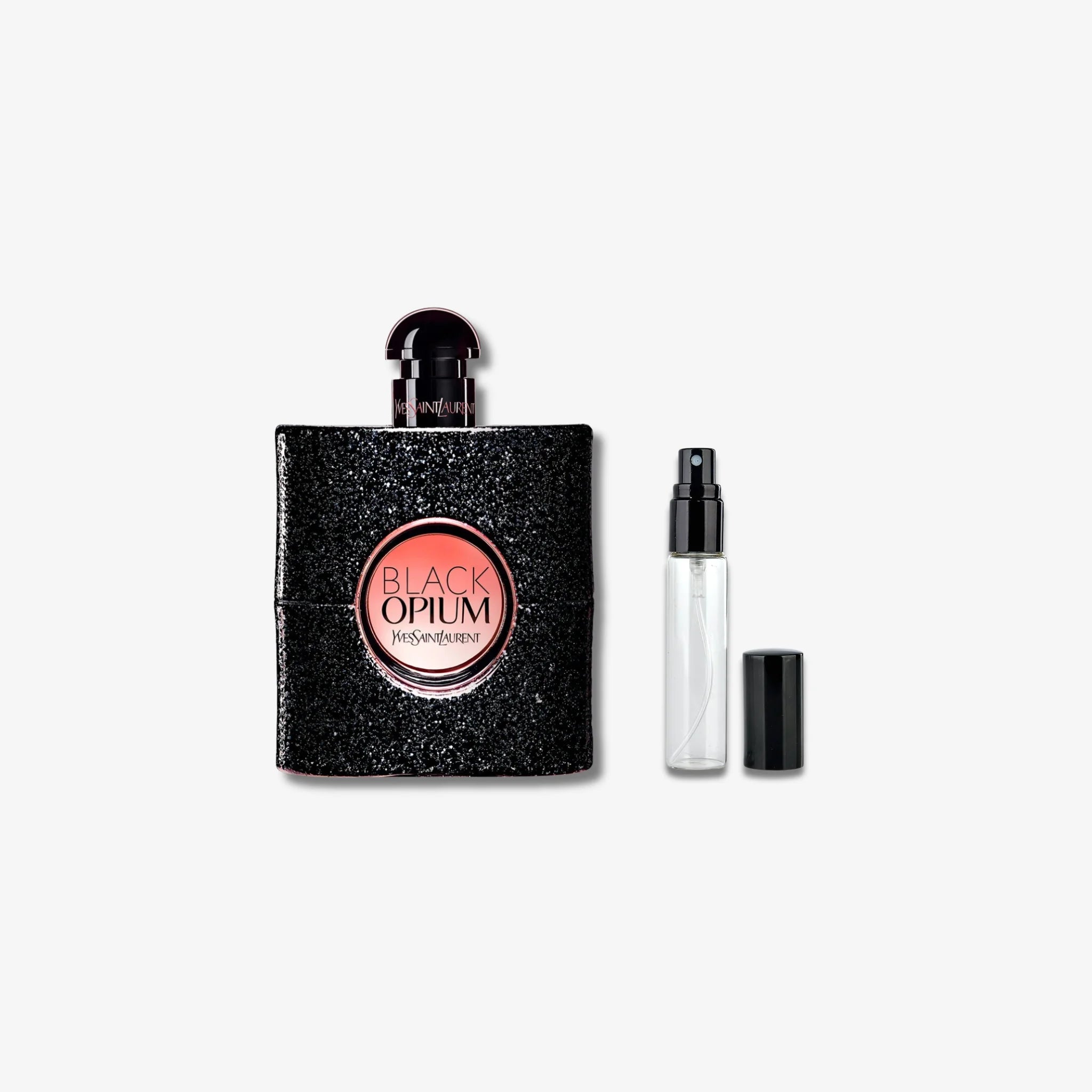 Black Opium perfume bottle and travel-sized version on a white background
