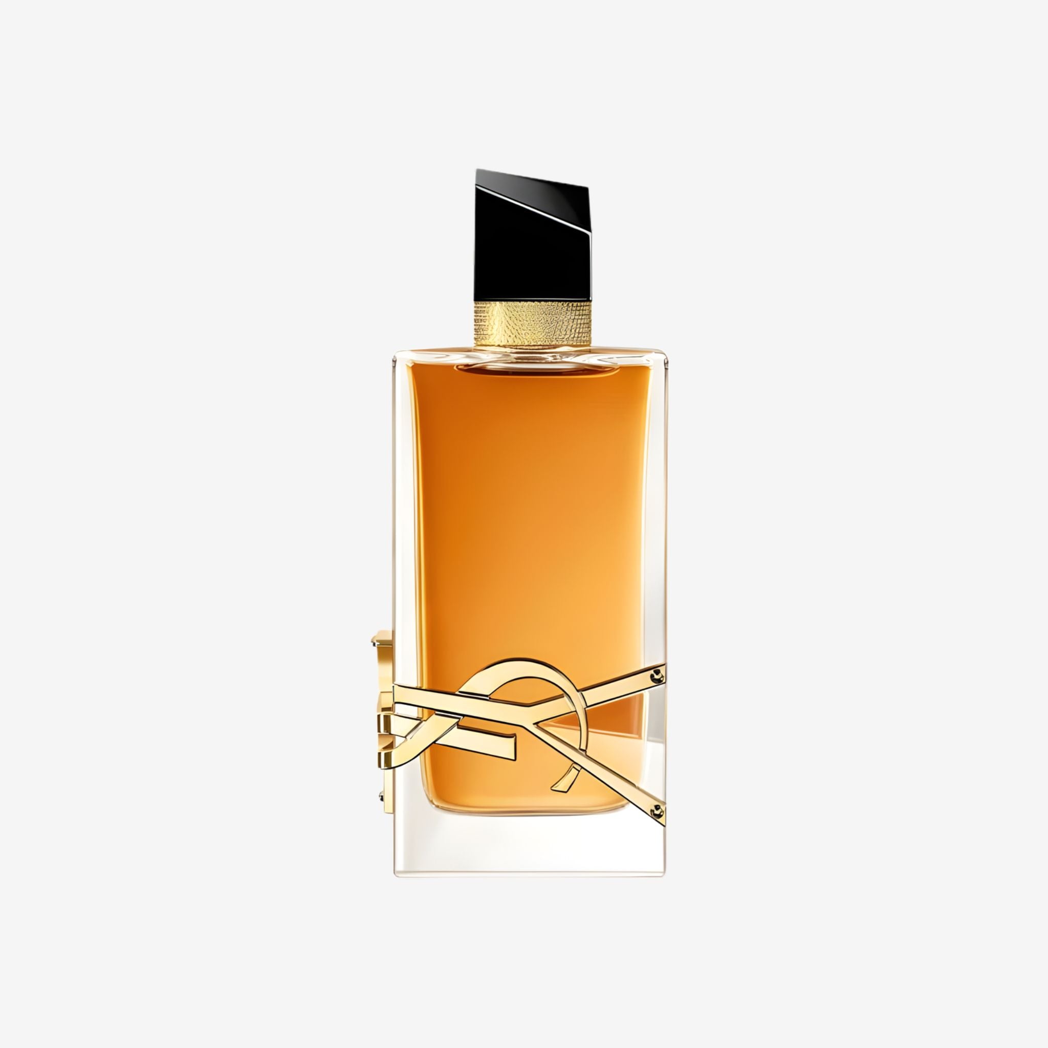 Close-up of YSL Libre Intense EDP bottle featuring the iconic gold YSL logo wrapped around the sleek, amber-toned glass.
