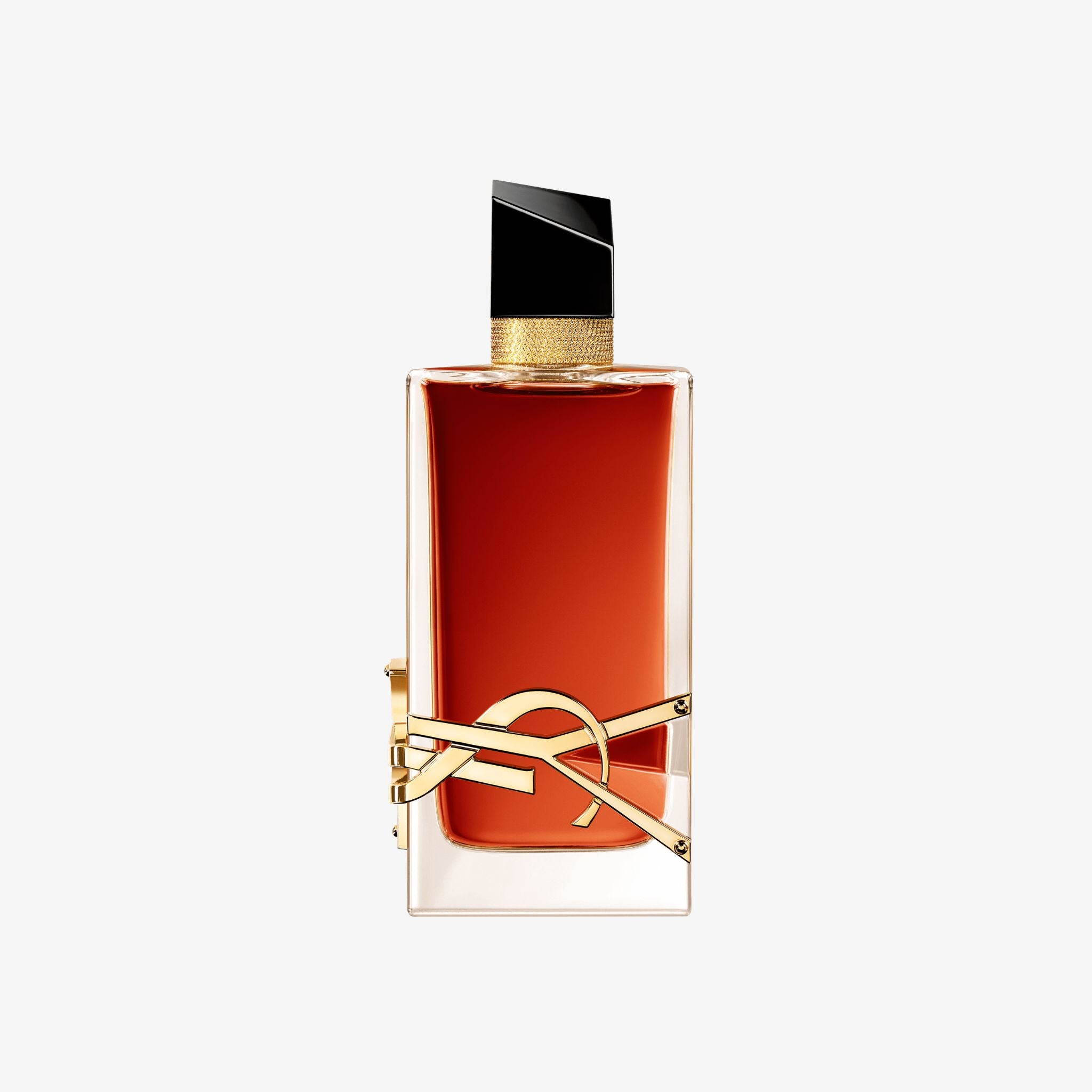 Close-up of YSL Libre Le Parfum 90ml bottle featuring the iconic gold YSL logo and deep amber-colored perfume glass.