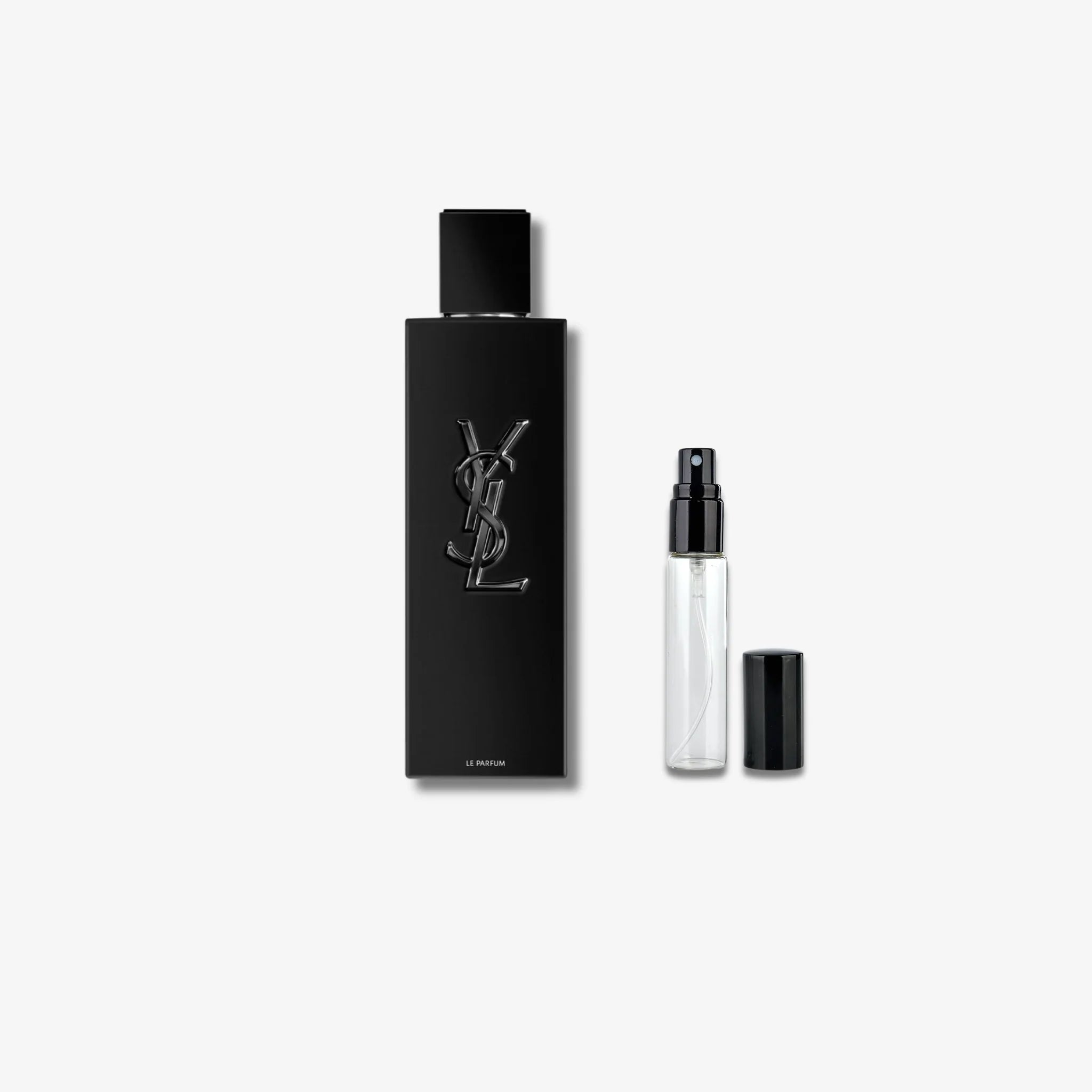 Black YSL Myself Le Parfum bottle and smaller spray bottle on a white background