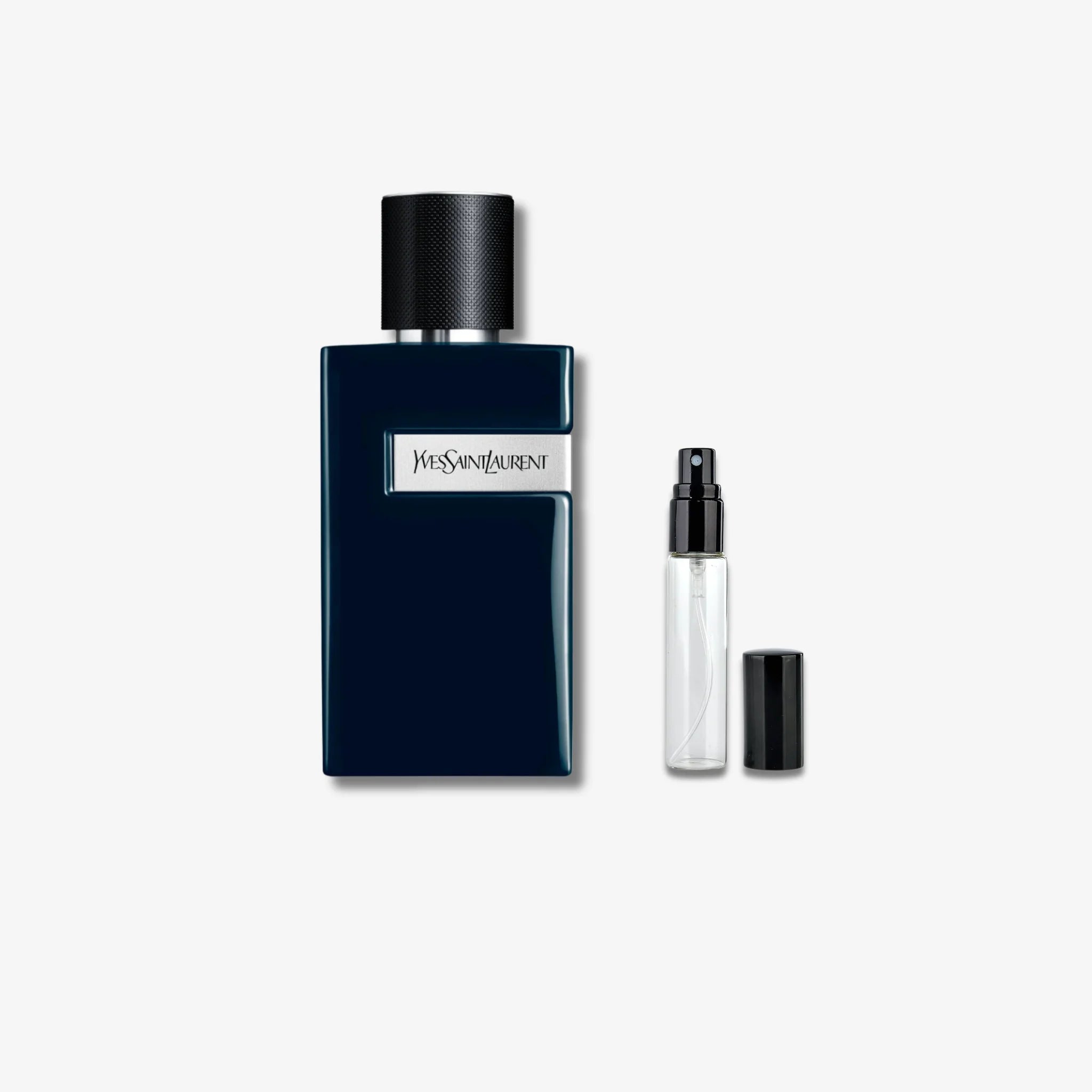 Yves Saint Laurent perfume bottle with a smaller travel-sized version on a white background